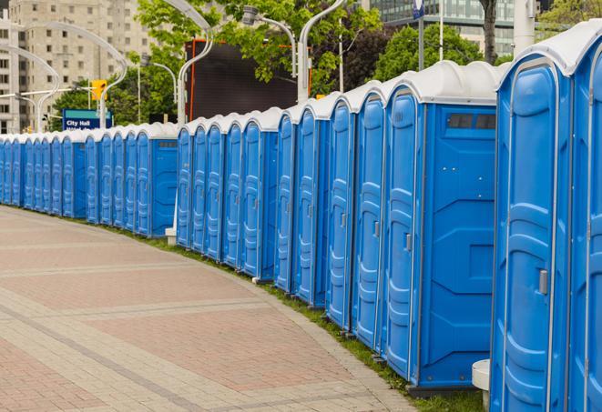 portable restrooms lined up at a marathon, ensuring runners can take a much-needed bathroom break in Bettendorf